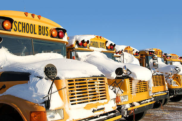 School buses in snow